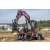 kubota-kw115-koparka-kolowa-silownik-wysiegnika-ramie-koparkowe-uklad-hydrauliczny-widoczny-chwytak